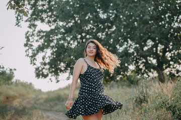 Young girl in summer time full of joy and harmony