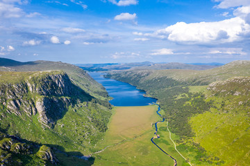 Aerial view of the Glenveagh National Park with castle Castle and Loch in the background - County...