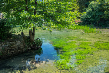 Scenic waterfall cascades on the river Sluncica. Magnificent Southern Europe, Croatia, small town Slunj. Beautiful day. The concept of ecological, active and photo tourism