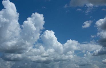 Naklejka na ściany i meble cludsscape wih blue sky white and dark clouds in bavaria