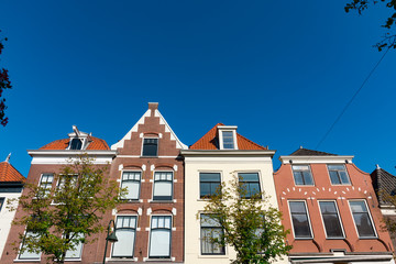 Fototapeta na wymiar houses in street called Binnenwatersloot, in Delft, The Netherlands