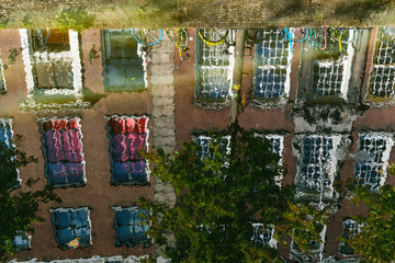 Reflection of houses and bikes in the oldest canal (Oude Delft) of Delft, The Netherlands