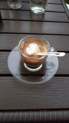 cup of coffee on wooden table