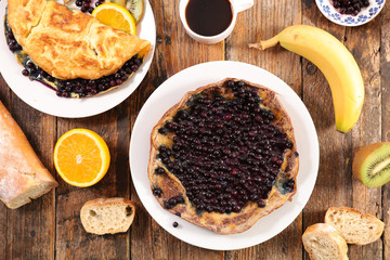 omelet with blueberry, banana and coffee cup