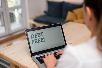 Conceptual hand writing showing Debt Free. Concept meaning does not owning any money or things to...