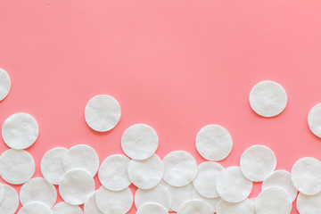 Frame from cotton pads on pink background top view mock up