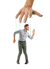 Hand of puppeteer manipulating man as marionette on white background