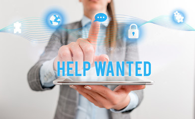 Conceptual hand writing showing Help Wanted. Concept meaning An ad in the paper an employer places...