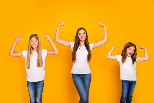 Photo of incredible three ladies showing power in arms wear casual clothes isolated yellow background