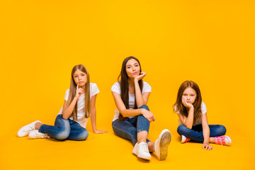 Full size photo of amazing three ladies sitting floor not interested in talk wear casual clothes isolated yellow background