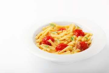IItalian food background. Maccheroni pasta with tomatoes