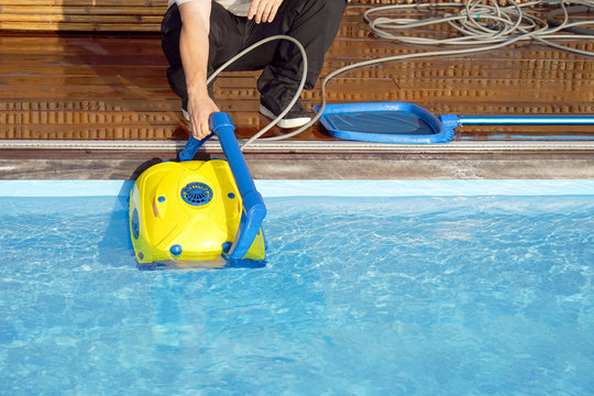 Pool cleaner during his work. Cleaning robot for cleaning the botton of swimming pools.  Automatic pool cleaners.    