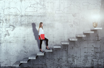 Side view of young businesswoman climbing the stairs with idea lamp on concrete background