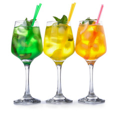 Different cocktails in glasses on white background