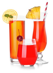 Different cocktails in glasses on white background