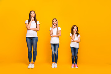 Obraz premium Full length photo of three minded sister ladies wear casual outfit isolated yellow background