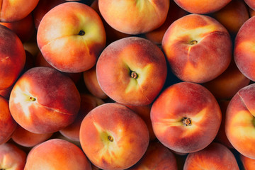 Many ripe peaches as background