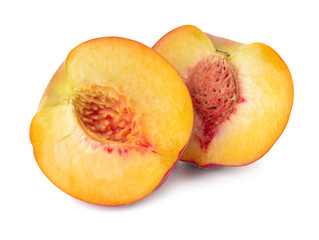 Ripe cut peach on white background