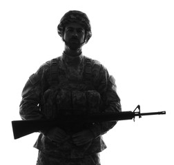 Silhouette of soldier with assault rifle on white background