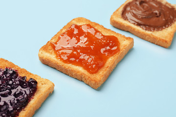 Different tasty sandwiches on color background