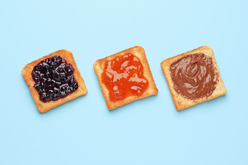 Different tasty sandwiches on color background