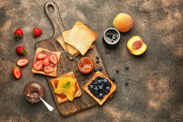 Different tasty sandwiches on grey background