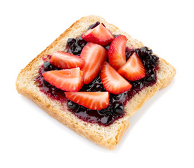 Tasty toasted bread with jam and strawberry on white background