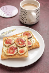 Plate with tasty sandwiches on table