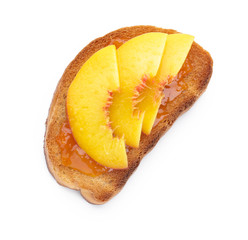 Tasty toasted bread with fruit jam on white background