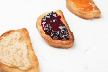 Different tasty sandwiches on light background