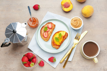 Plate with tasty sandwiches and cup of coffee on table