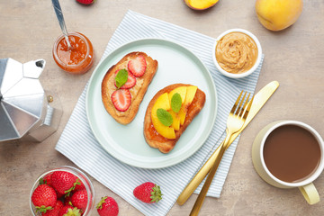 Plate with tasty sandwiches and cup of coffee on table