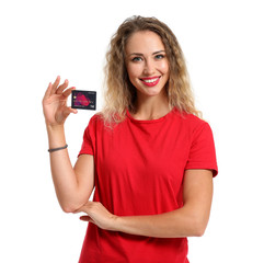 Naklejka premium Young woman with credit card on white background