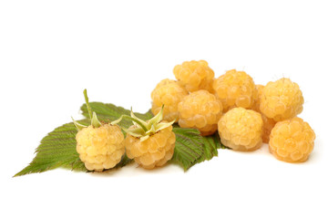 Fresh yellow raspberries with leaves