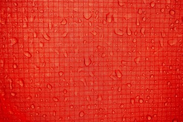 red tent close-up, strong and durable material of long-lasting tourist equipment and sportswear