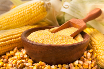 Homemade organically produced corn gritz polenta on a rustic wooden table