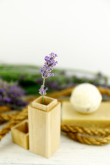 The concept of home comfort with lavender. Lavender flowers on shabbi white wooden background.