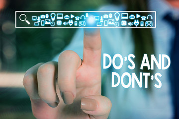 Text sign showing Do S And Dont S. Business photo text Rules or customs concerning some activity or actions Woman wear formal work suit presenting presentation using smart device