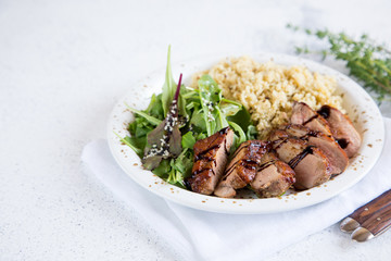 healthy lunch. Serving Couscous with Salad and Roasted Duck Breasts