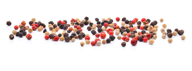Black, red and white pepper isolated on white background