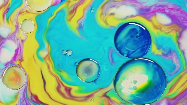 Top view to beautiful combination of paint and ink in milk and oil. Fantastic structure of colorful bubbles. Abstract colorful paint. Good idea for mobile phone home screen style, themes or wallpaper.