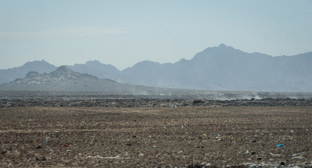 Trash and Rubbish in the dry landscape along the roadside on the Northern coast of Peru, South America.