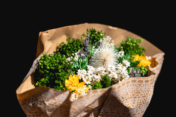 basket of dried flowers under the sun