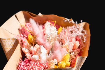 bouquet of pink and yellow dried flowers