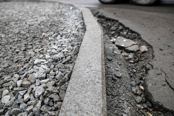 Repair of asphalt in the yard of an apartment building. Renovation of the road. The details of the repair of asphalt roads.
