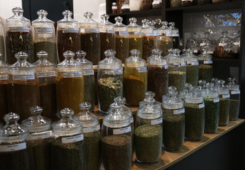 Various spices in glass jars on farmer market in Russia