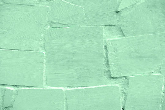Old mint colored brick wall texture for background.