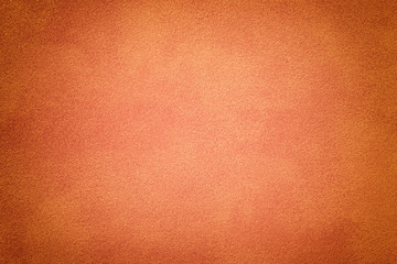 Coral matt suede fabric closeup. Velvet texture.