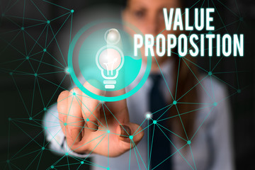 Word writing text Value Proposition. Business photo showcasing feature intended to make a company or product attractive Female human wear formal work suit presenting presentation use smart device