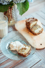 Vegan banana bread with green buckwheat and glass oat milk.